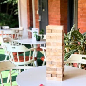 Outdoor space with giant jenga on table at the Wink and Wave Spa at Bala Bay Inn